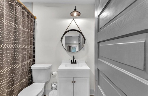 Summerville House | 1 bed 1 bath home that sleeps max 4 guests with sleeping arrangements being a queen bed and a fold out couch that is queen sized.