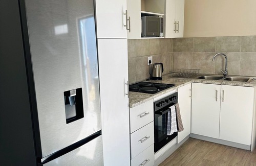 Windhoek Apartment | 1 bedroom apartment with stunning mountainous and sunset views.