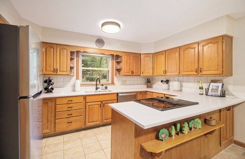 South Bend House | 1 mile from ND! Beautifully renovated and roomy 4-bed, 3-bath home, wooded lot.
