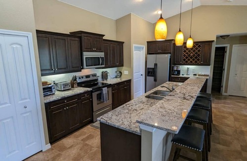 Englewood East House | 10 Minutes to Beach Bliss, with Heated Privet Poolside Haven!