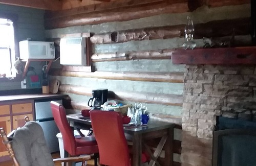 Eureka Springs Cabin | 100 year old log cabin. Spend your relaxing getaway with us