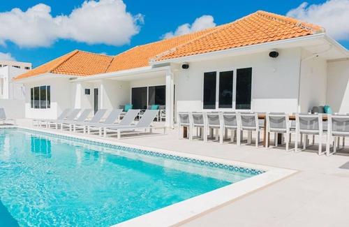 Oranjestad Villa | 10BR Luxe Beachfront Pool Villa Playa by Bocobay