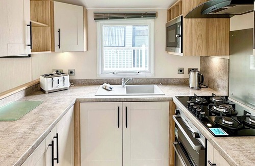 Cross Inn House | 12ft-wide luxury caravan with one double with en suite shower and one twin.