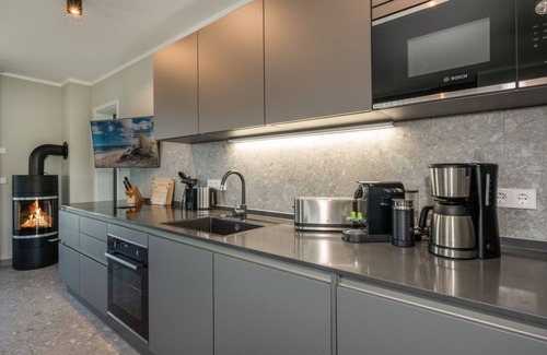 Lubmin Apartment | 150m to the beach! Modern 60m² sea view apartment: balcony & fireplace, for 4 pers.