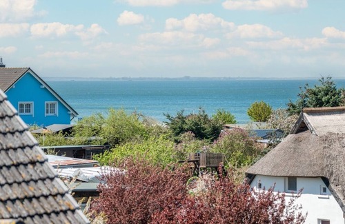 Lubmin Apartment | 150m to the beach! Modern 60m² sea view apartment: balcony & fireplace, for 4 pers.