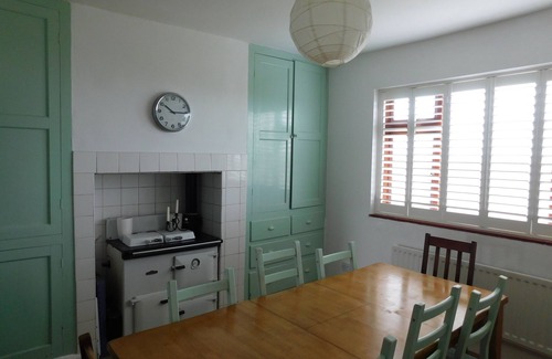 Ty Croes House | 1930's bungalow nr Rhosneigr, opposite beach, large garden and amazing views.