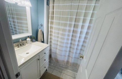 Emerald Isle House | 1BR beach getaway: pool, pier, sunset views. Full amenities. Near beach access.