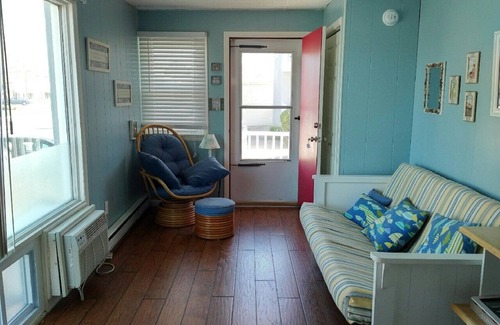 Stone Harbor Condo | 1st Floor Front Efficiency Unit, right side, corner Tables and chairs in the court yard.