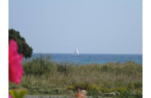 Pietracorbara Apartment | 1st floor Villa El bimbo 50 metres from the sandy beach