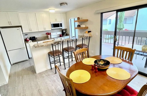 East Beach Condo | 2 bed spacious condo steps from beach + pool!