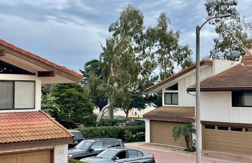 East Beach Condo | 2 bed spacious condo steps from beach + pool!