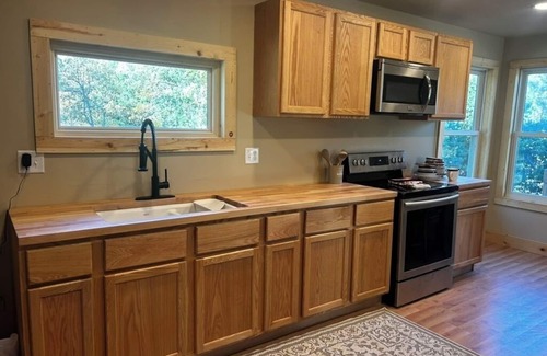 Sturgis Cabin | 2-bedroom, 1 bathroom log cabin Top floor offers the perfect retreat close to downtown Sturgis. With breathtaking views and a peaceful wooded setting, this cozy home-away-from-home. Comfortably accommodating up to 4 guests.
