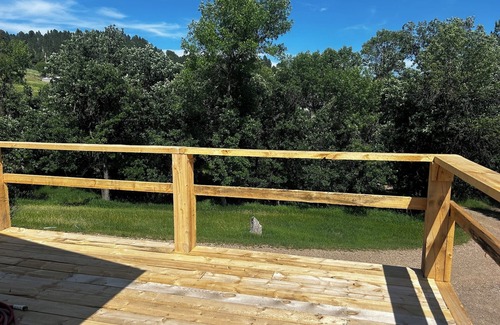 Sturgis Cabin | 2-bedroom, 1 bathroom log cabin Top floor offers the perfect retreat close to downtown Sturgis. With breathtaking views and a peaceful wooded setting, this cozy home-away-from-home. Comfortably accommodating up to 4 guests.