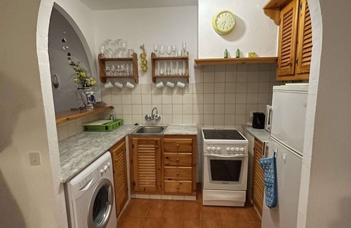 Arenal d'en Castell Apartment | 2 bedroom Apartment With Pool, Shared Gardens And Sea Views