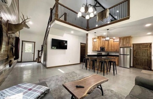 Dennison Cabin | 2 Bedroom With Loft - 2.25 miles from Enchanted Acres Wedding Venues.