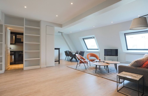 4th Arrondissement Apartment | 2 BR/2BA Notre Dame and Eiffel Tower view top floor A/C in living room