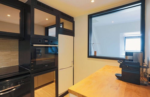 4th Arrondissement Apartment | 2 BR/2BA Notre Dame and Eiffel Tower view top floor A/C in living room
