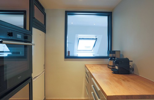 4th Arrondissement Apartment | 2 BR/2BA Notre Dame and Eiffel Tower view top floor A/C in living room