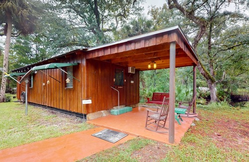 Bronson Cabin | 2 riverfront cabins with large yard, grill, firepit, canoe, & private W/D