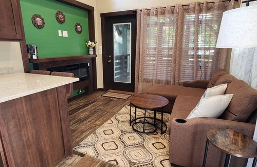 Mill Spring House | 2-story creek side tiny home, dog-friendly, screened in porch, quick walk to pool and playground, sleeps 6.