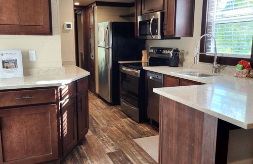 Mill Spring House | 2-story creek side tiny home, dog-friendly, screened in porch, quick walk to pool and playground, sleeps 6.