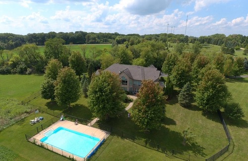 Marengo House | 20-acre Private Family Farmhouse with Event Barn, Private Fishing Pond, and Pool