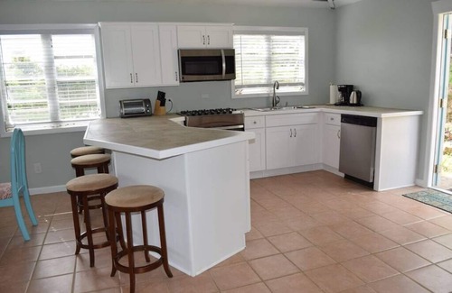Lower Carolina Villa | 20% off! Charming cottage -water view, hot tub, outdoor shower, battery backup!