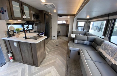 Larsen RV Rental | 2022 Glamper on Lake Poygan with boat slip available!