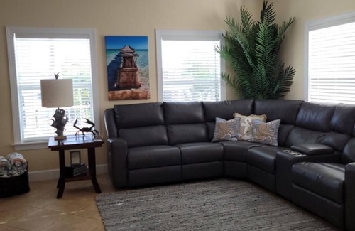 Breezeswept Beach Estates House | 3/2 two story home with pool and 80' dock on canal ocean side.