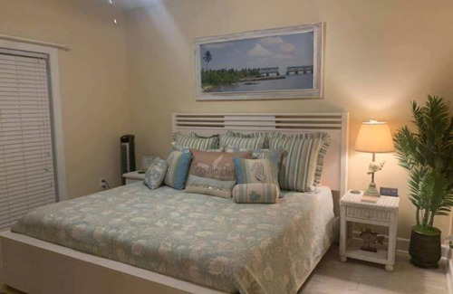 Breezeswept Beach Estates House | 3/2 two story home with pool and 80' dock on canal ocean side.