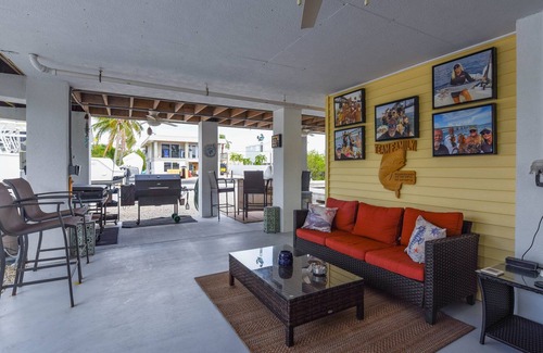 Breezeswept Beach Estates House | 3 Bed/2 Bath Canal Front Home in Ramrod Key 80' Dock and Pool