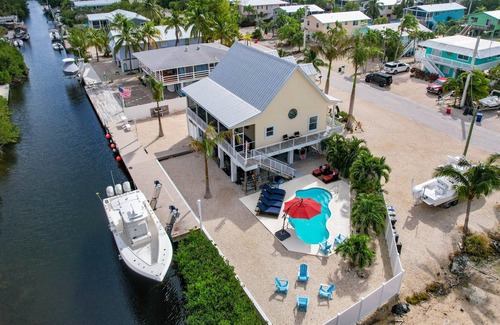 Breezeswept Beach Estates House | 3 Bed/2 Bath Canal Front Home in Ramrod Key 80' Dock and Pool