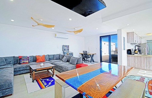 El Sargento House | 3 bedroom, 3 bath premium repurposed shipping container home. Game room w/darts, shuffleboard, video games, new 8 person hot tub, multiple decks w/firepits, fast Wifi (250 mb+)w/Starlink backup. Use of SUPs & beach chairs/shade/games.