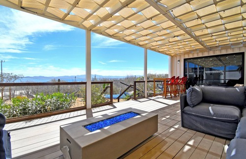 El Sargento House | 3 bedroom, 3 bath premium repurposed shipping container home. Game room w/darts, shuffleboard, video games, new 8 person hot tub, multiple decks w/firepits, fast Wifi (250 mb+)w/Starlink backup. Use of SUPs & beach chairs/shade/games.