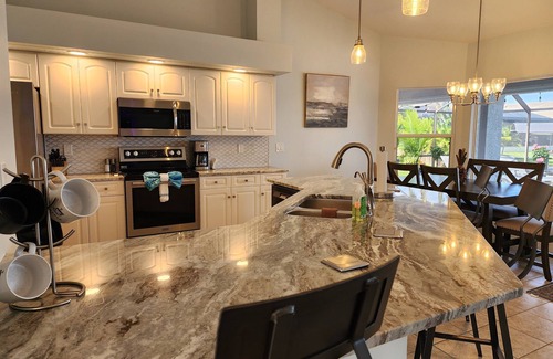 Burnt Store House | 3-bedroom Gulf access heated pool lanai tiki dock