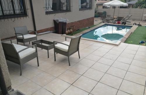 Greater Johannesburg Metropolitan Area Apartment | 3-Bedroom Oasis with Pool