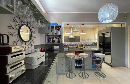 Greater Johannesburg Metropolitan Area Apartment | 3-Bedroom Oasis with Pool