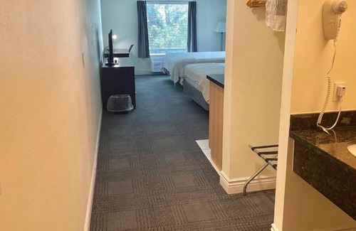 Cuero House | 3 Double Queen With Kitchenette at FairBridge Inn & Suites Cuero, Pet-Friendly!