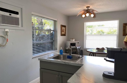 Holmes Beach Apartment | 3 Minute walk to beautiful AMI beach! Old Florida Charm with a Modern Flair!