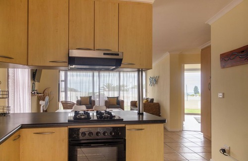 Jeffreys Bay Apartment | 350 metre from beach. 2-bedroom, 2-bathroom ground floor apt with patio & braai