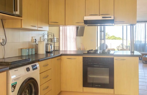 Jeffreys Bay Apartment | 350 metre from beach. 2-bedroom, 2-bathroom ground floor apt with patio & braai