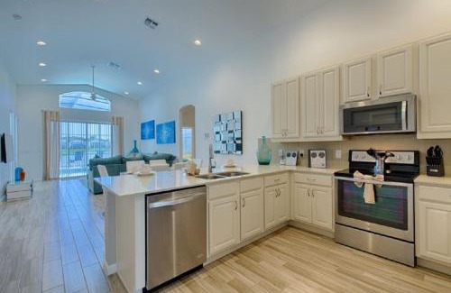 Kissimmee Villa | #372-Welcome to Lightwater Villa, your Modern Disney Vacation home! South-Facing Pool & Spa Overlooking Lake