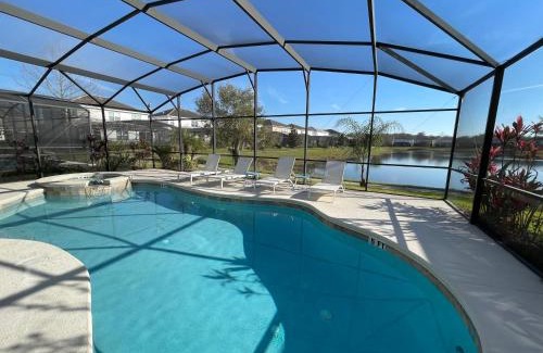 Kissimmee Villa | #372-Welcome to Lightwater Villa, your Modern Disney Vacation home! South-Facing Pool & Spa Overlooking Lake