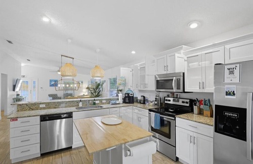 Palm Coast House | 3BR Coastal Home + Heated Pool, Golf Cart & Bikes