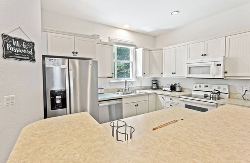 Bermuda Bay House | 3BR Family Townhouse w/Pool, Games & Dog-Friendly Patio