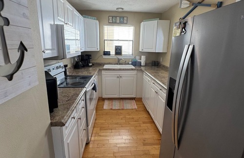 Holiday Isle Villa | 3BR Villa in Sandpiper Cove with private beach access and multiple amenities.