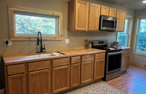 Sturgis Cabin | 4-bedroom, 2-bathroom log cabin offers the perfect retreat close to downtown Sturgis. With breathtaking views and a peaceful wooded setting, this cozy home-away-from-home is perfect for families or groups, comfortably accommodating up to 8 guests.