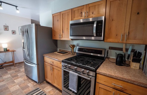 Lander House | 4-Bedroom Home with Fenced Backyard