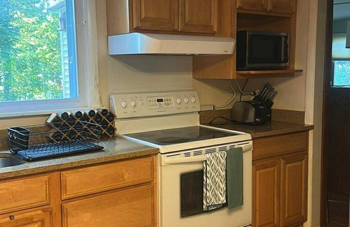Midland House | 4-bedroom house close to all midland has to offer can sleep up to 11 guests.