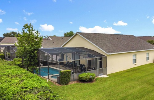 Four Corners Villa | 4-bedroom villa in welcoming Clermont with fitness room, AC
